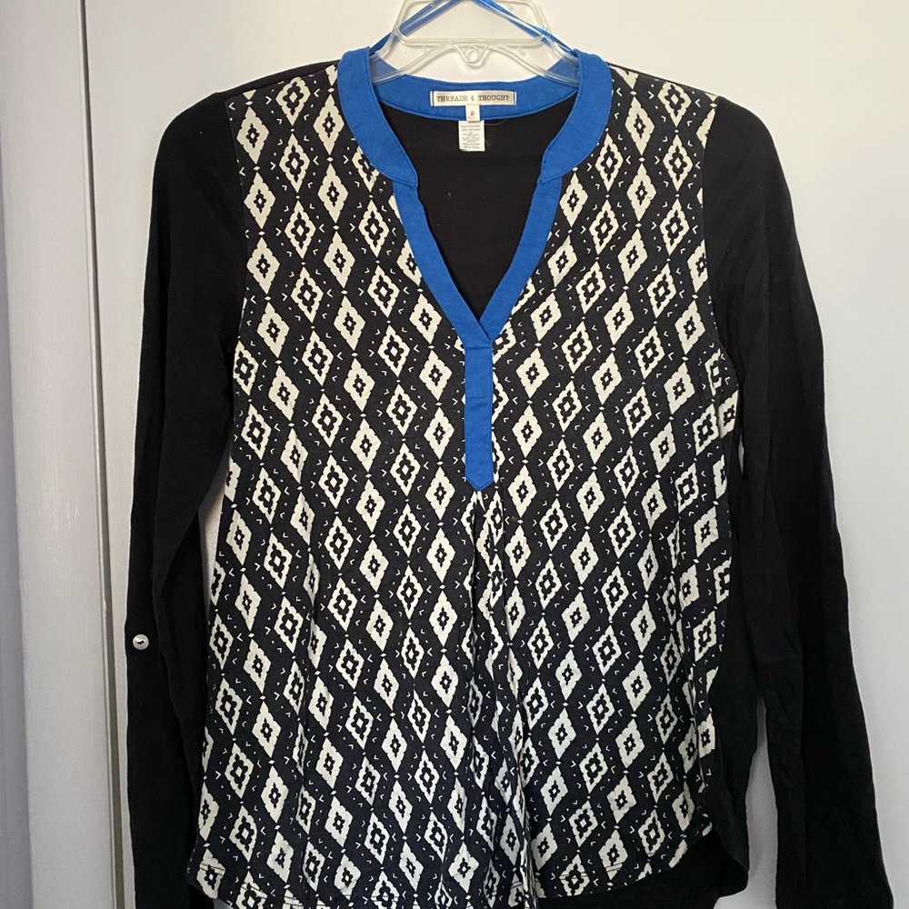 Organic cotton tunic-style top, long sleeves rolled up with tab.  No flaws.